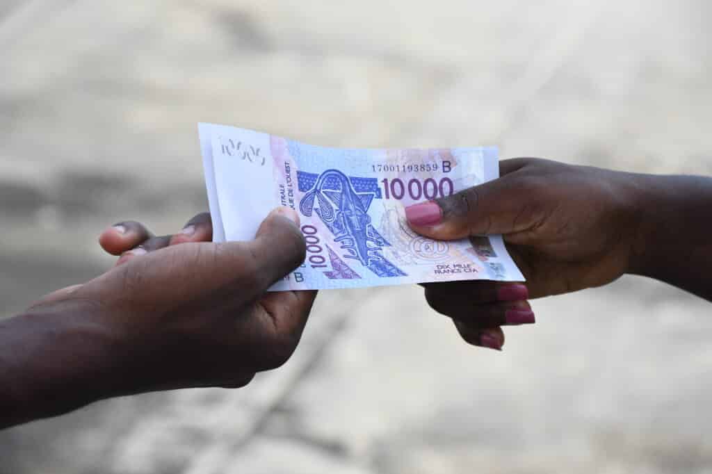 An-image-of-two-hands-holding-on-to-money-1024x682.jpeg